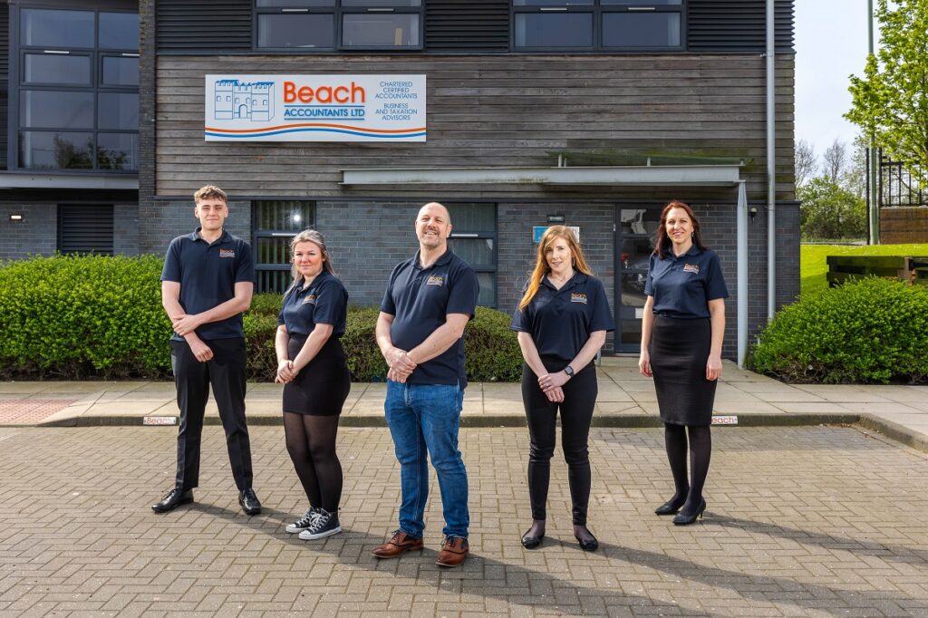 Gavin Spencer, founder and director of Beach Accountants with four new members of staff