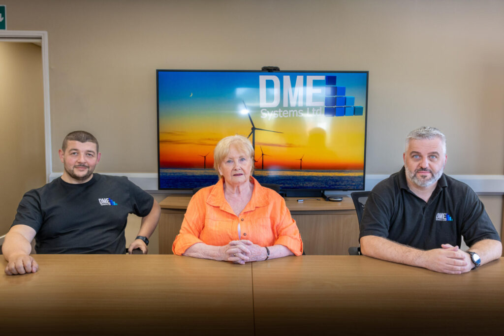 Darren Coombe (left) with Cllr Margaret Meling, South Tyneside Council portfolio holder for Economic Growth and Transport and Stephen Dixon from DME Systems (right)