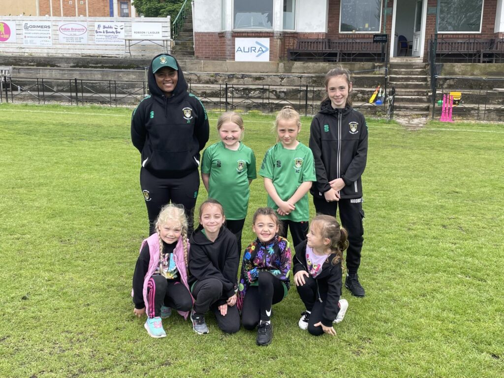 South Shields Girls Under 8 Cricket Team with coach Josphine Nkomo. Four girls playing their first ever game.