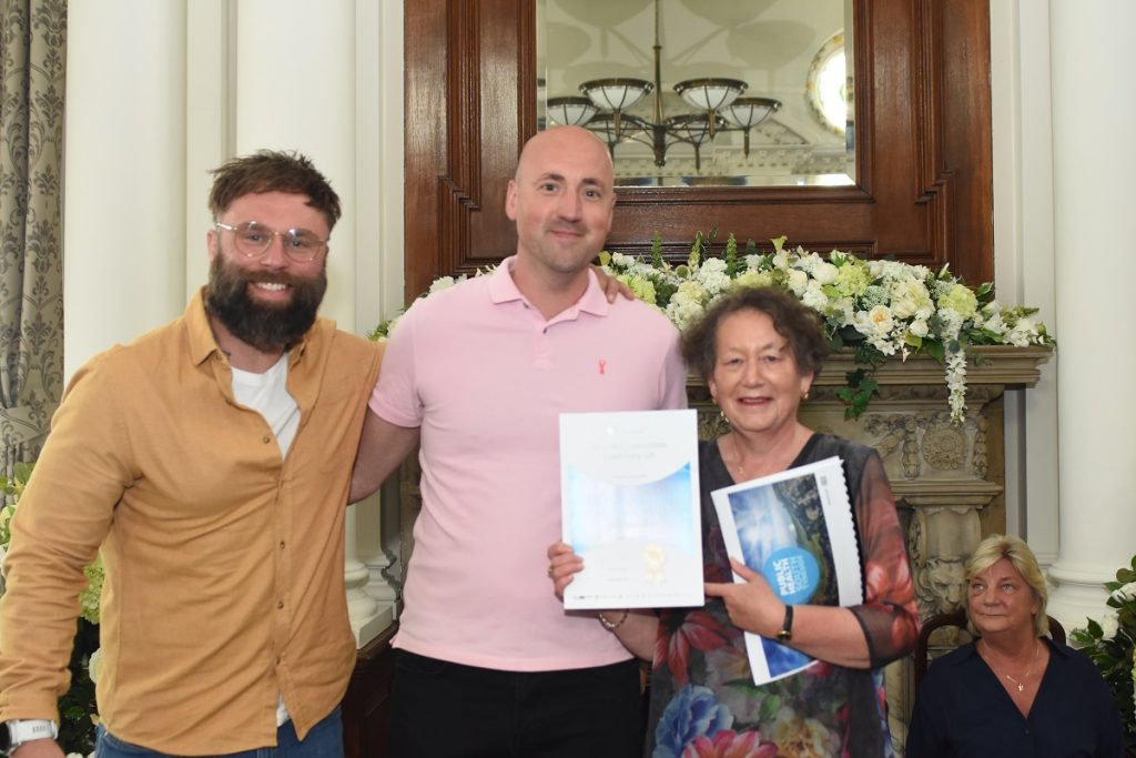 Representatives from Hitachi Construction Machinery UK receiving the GOLD Better Health at Work Award with with Councillor Ruth Berkley, Lead Member for Adults, Health and Independence at South Tyneside Council (right)