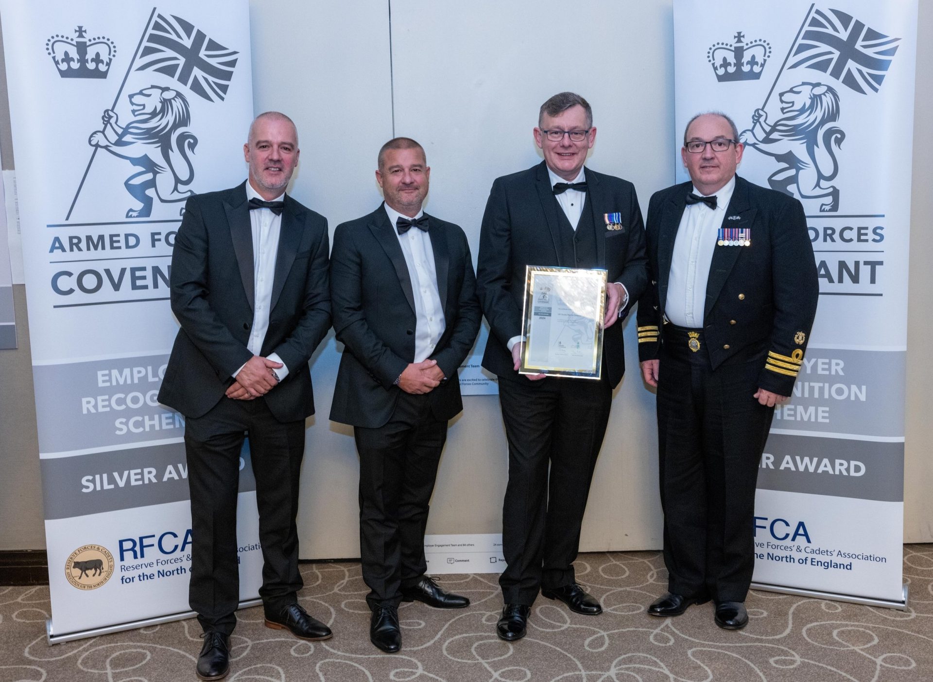UK Docks' management team receiving previous Silver Award