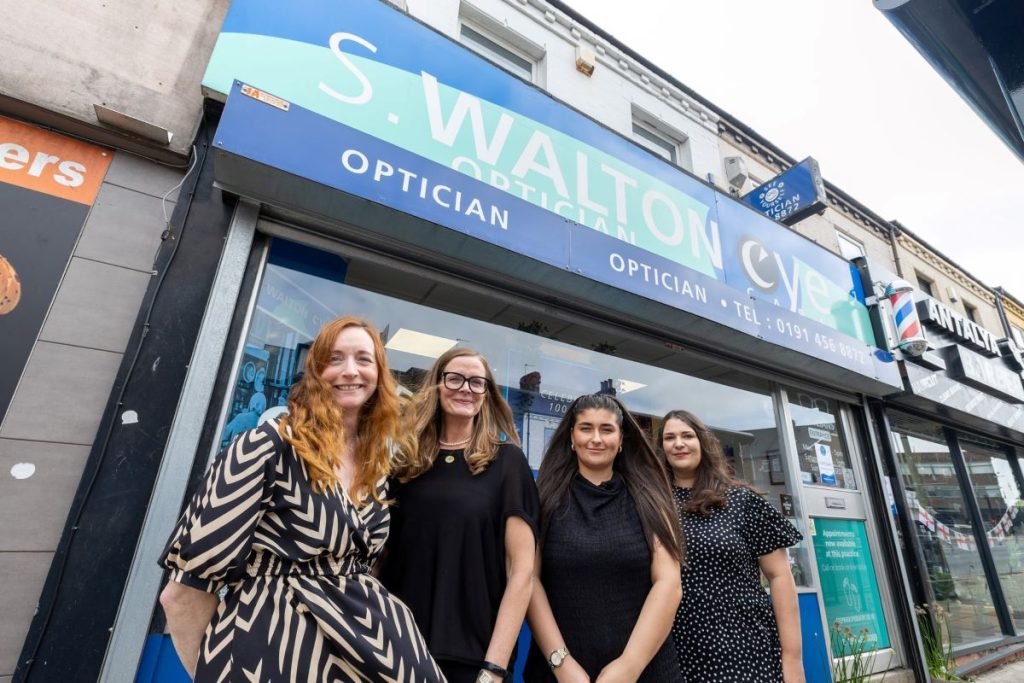 Kaye Winship and staff outside the 100 year old opticians